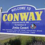 Welcome sign for Conway, highlighting its incorporation date and Jimbo Covert's achievements